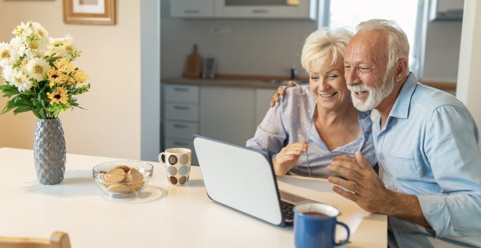 Older couple using a laptop