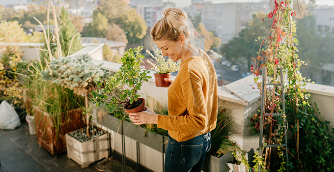 woman gardening in greenhouse